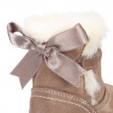 Baby girl bootie with BOW, hook and loop strap closure in suede leather.