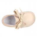 CEREMONY Girl Safari Boots with silk laces closure and waves in combined leather.