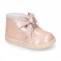 CEREMONY Girl Safari Boots with silk laces closure and waves in patent leather.