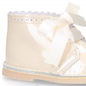 CEREMONY Girl Safari Boots with silk laces closure and waves in patent leather.