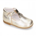 Classic Kids Laminated Nappa leather T-strap shoes with buckle fastening.