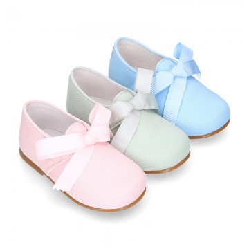 CEREMONY LINEN Laces up shoes for little kids in pastel colors.