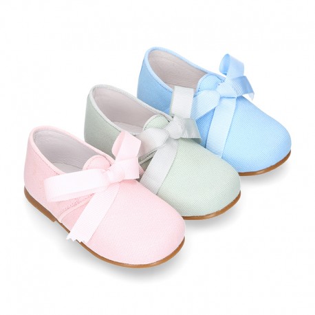 CEREMONY LINEN Laces up shoes for little kids in pastel colors.