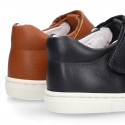 Nappa Leather Kids T-strap shoes with hook and loop strap closure with perforated design.