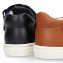 Nappa Leather Kids T-strap shoes with hook and loop strap closure with perforated design.