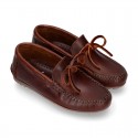 Tanned leather kids moccasins shoes with ties design in CLASSIC COLORS.