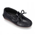 Tanned leather kids moccasins shoes with ties design in CLASSIC COLORS.