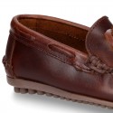 Tanned leather kids moccasins shoes with ties design in CLASSIC COLORS.