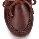 Tanned leather kids moccasins shoes with ties design in CLASSIC COLORS.