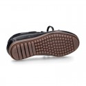 Tanned leather kids moccasins shoes with ties design in CLASSIC COLORS.