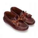 Tanned leather kids moccasins shoes with ties and TASSELS design.