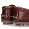 Tanned leather kids moccasins shoes with ties and TASSELS design.