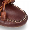 Tanned leather kids moccasins shoes with ties and TASSELS design.