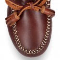 Tanned leather kids moccasins shoes with ties and TASSELS design.