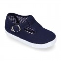 Cotton Canvas T-strap shoes with buckle fastening.