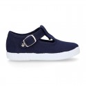 Cotton Canvas T-strap shoes with buckle fastening.