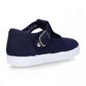 Cotton Canvas T-strap shoes with buckle fastening.