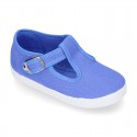 Cotton Canvas T-strap shoes with buckle fastening.