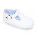 Cotton Canvas T-strap shoes with buckle fastening.