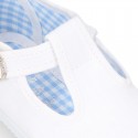 Cotton Canvas T-strap shoes with buckle fastening.