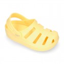 Kids jelly shoes with OLA MC CLOG design for beach and pool use.