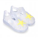 Classic style Kids jelly shoes with hook and loop strap closure and STARFISH design.