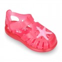 Classic style Kids jelly shoes with hook and loop strap closure and STARFISH design.