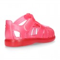 Classic style Kids jelly shoes with hook and loop strap closure and STARFISH design.