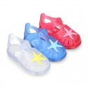 Classic style Kids jelly shoes with hook and loop strap closure and STARFISH design.