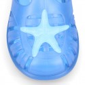 Classic style Kids jelly shoes with hook and loop strap closure and STARFISH design.