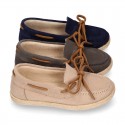 Suede leather Kids Moccasin shoes espadrille style with ribbons design.