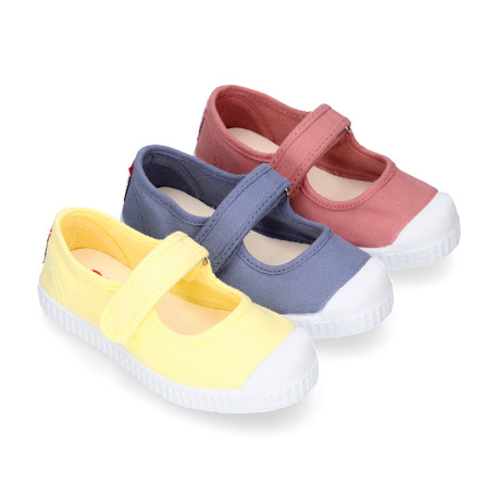 Cotton canvas Mary Janes Bamba type shoes in seasonal colors with hook and loop strap and toe cap.