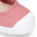 Cotton canvas Mary Janes Bamba type shoes in seasonal colors with hook and loop strap and toe cap.