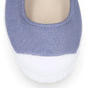 Cotton canvas Mary Janes Bamba type shoes in seasonal colors with hook and loop strap and toe cap.