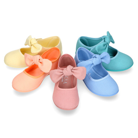 Cotton canvas Girl Mary Jane shoes with hook and loop strap and big bow design.