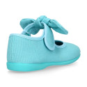 Cotton canvas Girl Mary Jane shoes with hook and loop strap and big bow design.