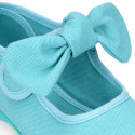 Cotton canvas Girl Mary Jane shoes with hook and loop strap and big bow design.