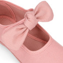 Cotton canvas Girl Mary Jane shoes with hook and loop strap and big bow design.