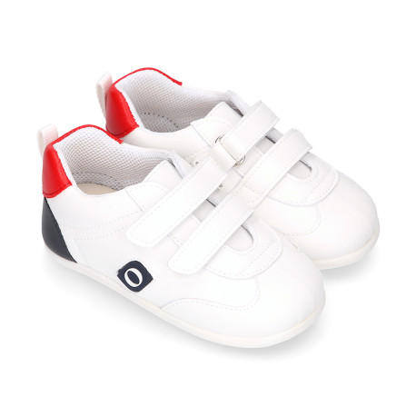 White color OKAA FLEX tennis kids shoes laceless and with zero drop.