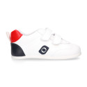 White color OKAA FLEX tennis kids shoes laceless and with zero drop.