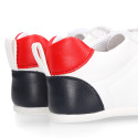 White color OKAA FLEX tennis kids shoes laceless and with zero drop.