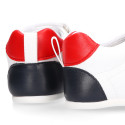 White color OKAA FLEX tennis kids shoes laceless and with zero drop.