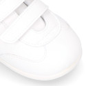 White color OKAA FLEX tennis kids shoes laceless and with zero drop.