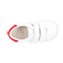 White color OKAA FLEX tennis kids shoes laceless and with zero drop.