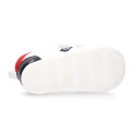 White color OKAA FLEX tennis kids shoes laceless and with zero drop.