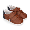 Tan color OKAA FLEX tennis kids shoes laceless and with zero drop.