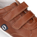 Tan color OKAA FLEX tennis kids shoes laceless and with zero drop.