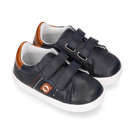 Navy blue color OKAA FLEX tennis kids shoes laceless combined with tan color.