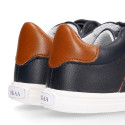 Navy blue color OKAA FLEX tennis kids shoes laceless combined with tan color.