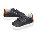 Navy blue color OKAA FLEX tennis kids shoes laceless combined with tan color.